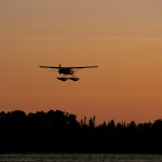 Silhouette of Wabakimi Air DHC-2 Beaver floatplane at sunrise after departing Mattice Lake